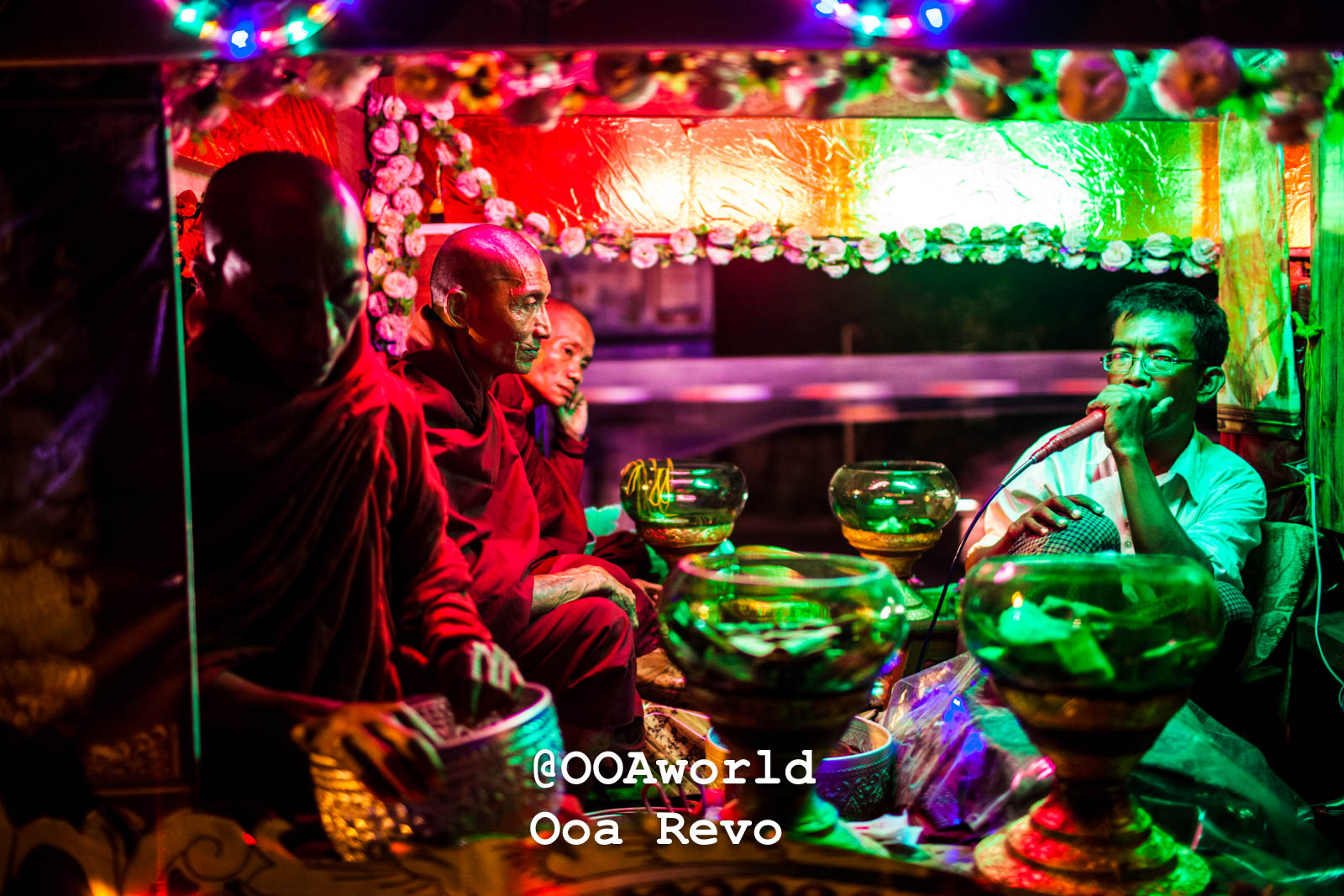 Yangon People and Streets Yangon Buddhist monks in colorful temple with illuminated decorations Photo OOAworld