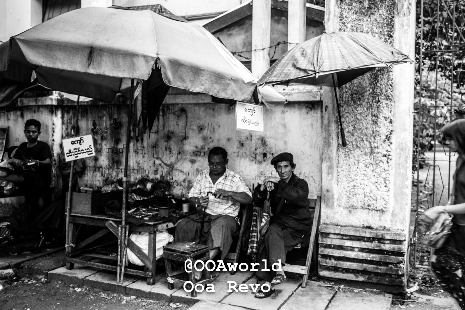 Yangon People and Streets Yangon street vendors under umbrellas black and white Photo OOAworld