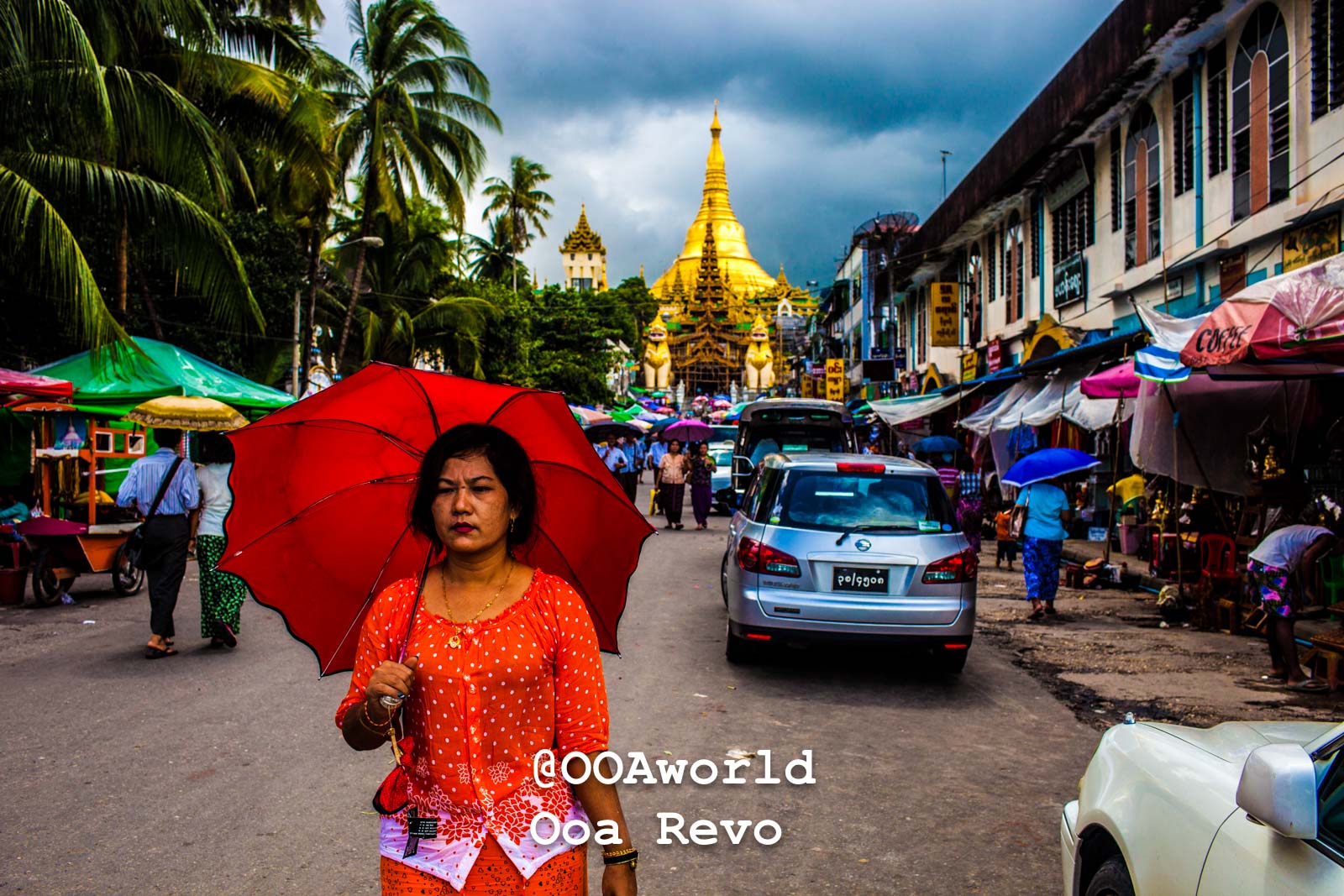 woman with red umbrella near Shwedagon Pagoda Yangon street market Photo OOAworld
