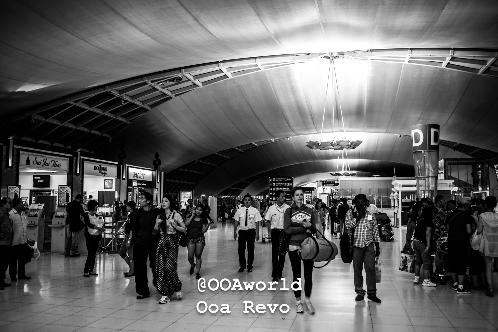 Yangon People and Streets Yangon bustling airport terminal with people walking Photo OOAworld