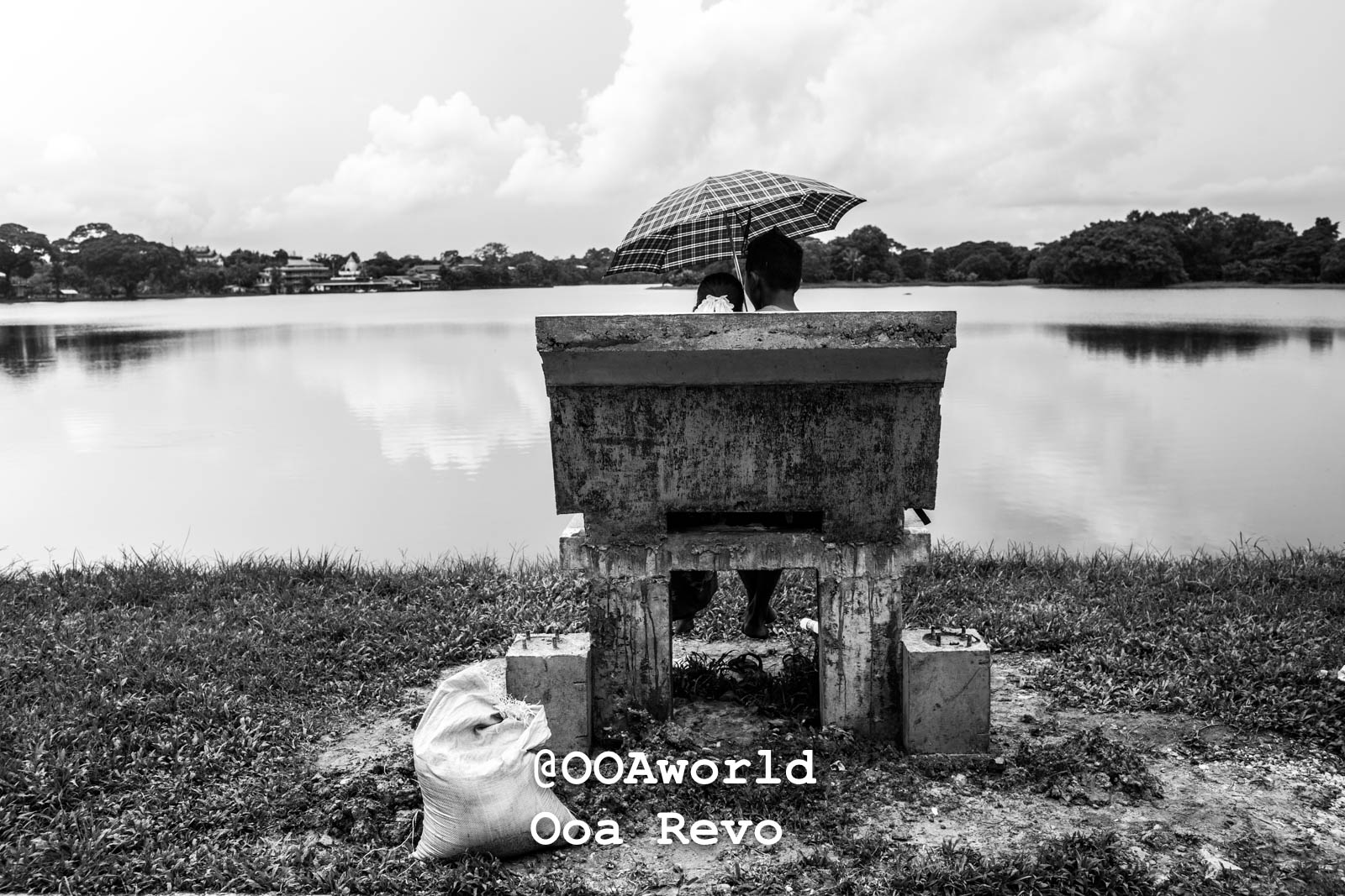 Yangon Streets and Textures Yangon couple under umbrella on bench lake view black and white Photo OOAworld Yangon Streets and Textures Yangon couple under umbrella on bench lake view black and white Photo OOAworld