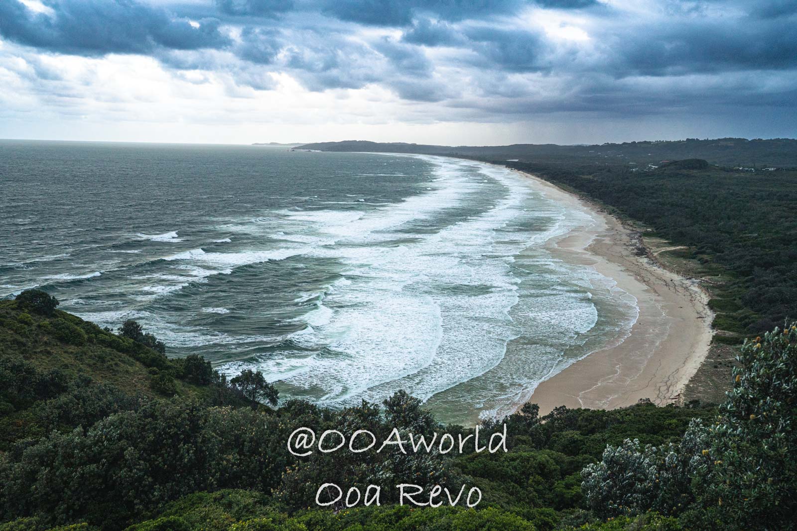 Byron Bay, Port Macquarie Australia Dramatic coastal landscape with waves and sandy beaches under cloudy skies Photo OOAworld