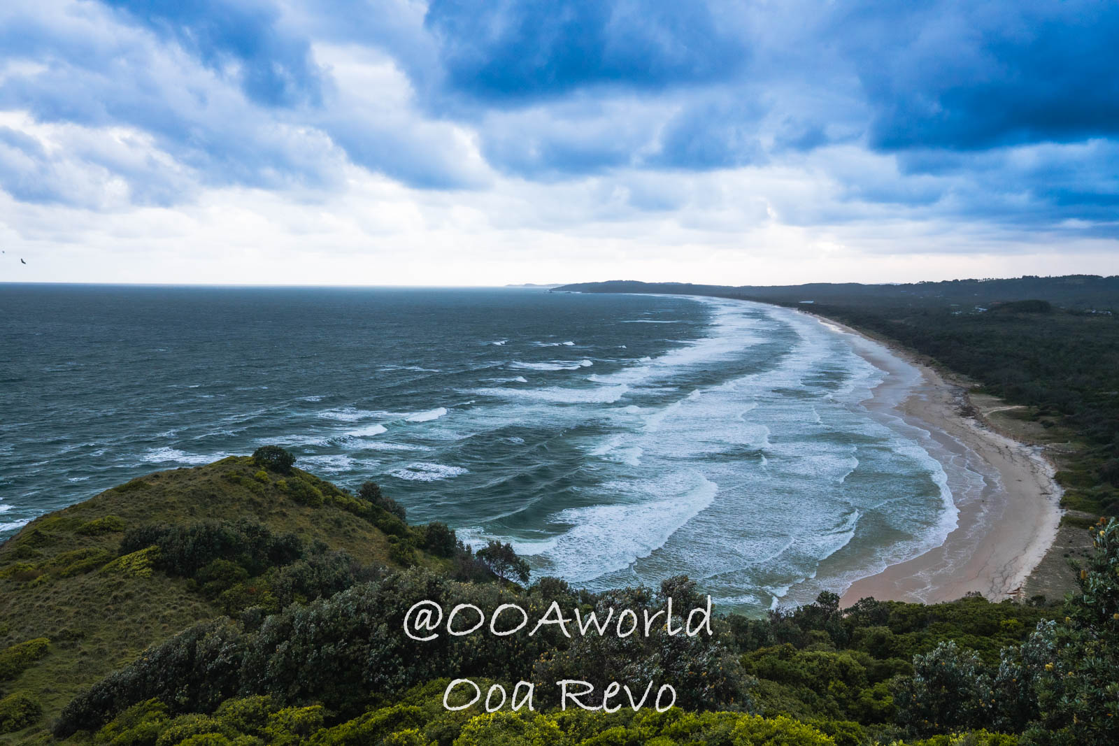 Byron Bay, Port Macquarie Australia coastal landscape with ocean waves and cloudy sky Photo OOAworld