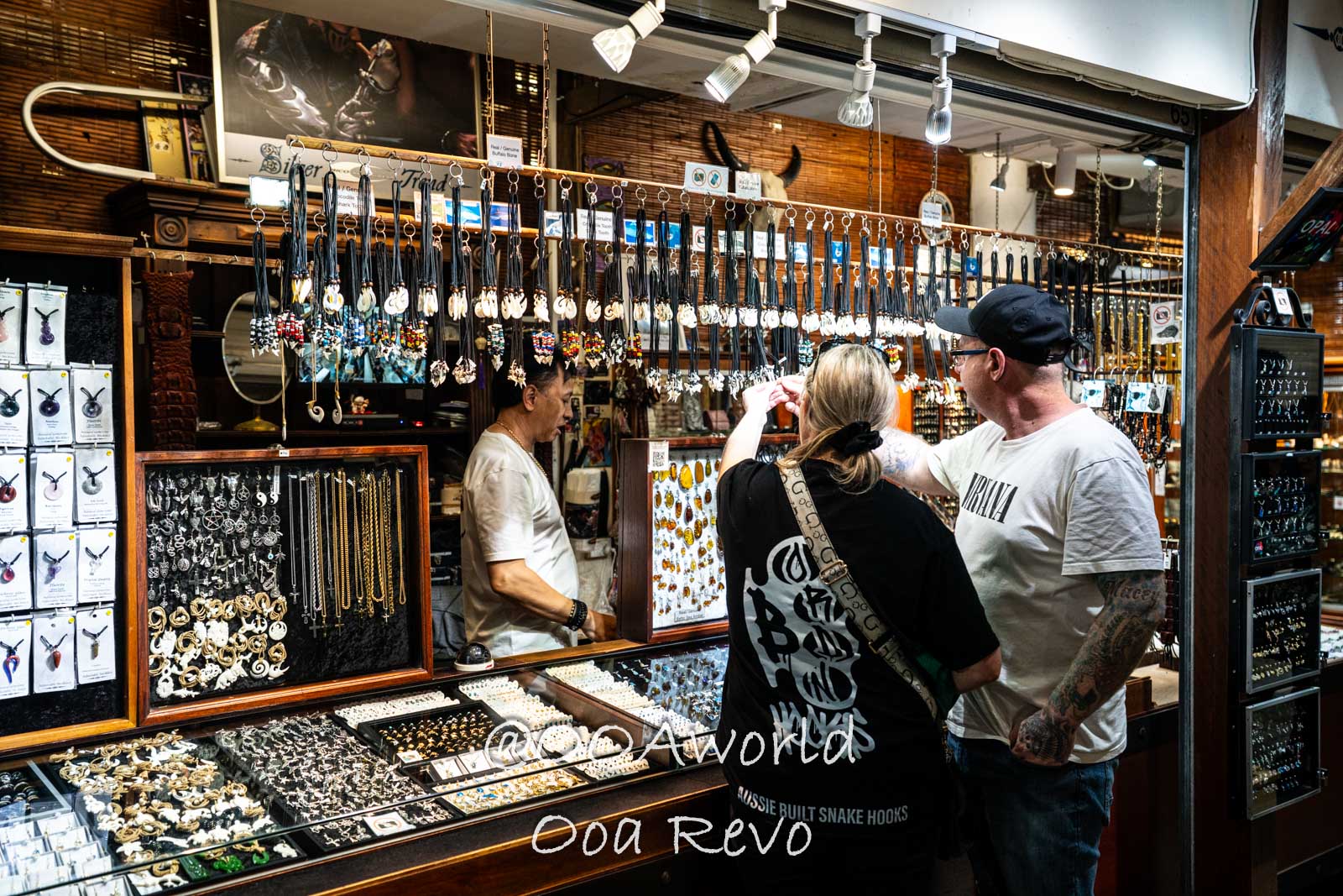 Cairns Australia shoppers exploring a jewelry stall Photo OOAworld