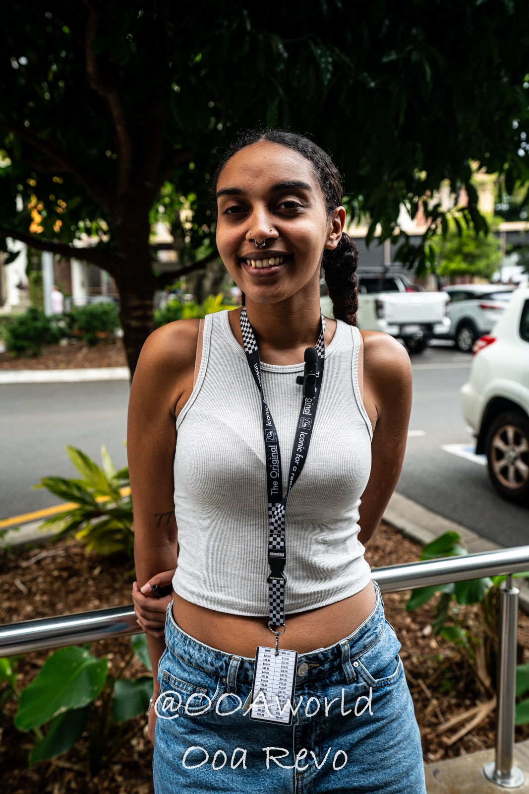 Cairns Australia smiling person with lanyard outdoors in city Photo OOAworld