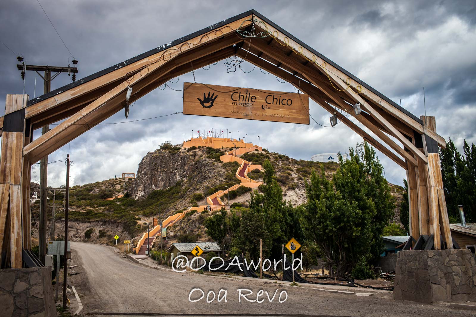 Chile Chico Entrance Scenic Path Photo OOAworld Chile Chico entrance sign with scenic hillside path Photo OOAworld