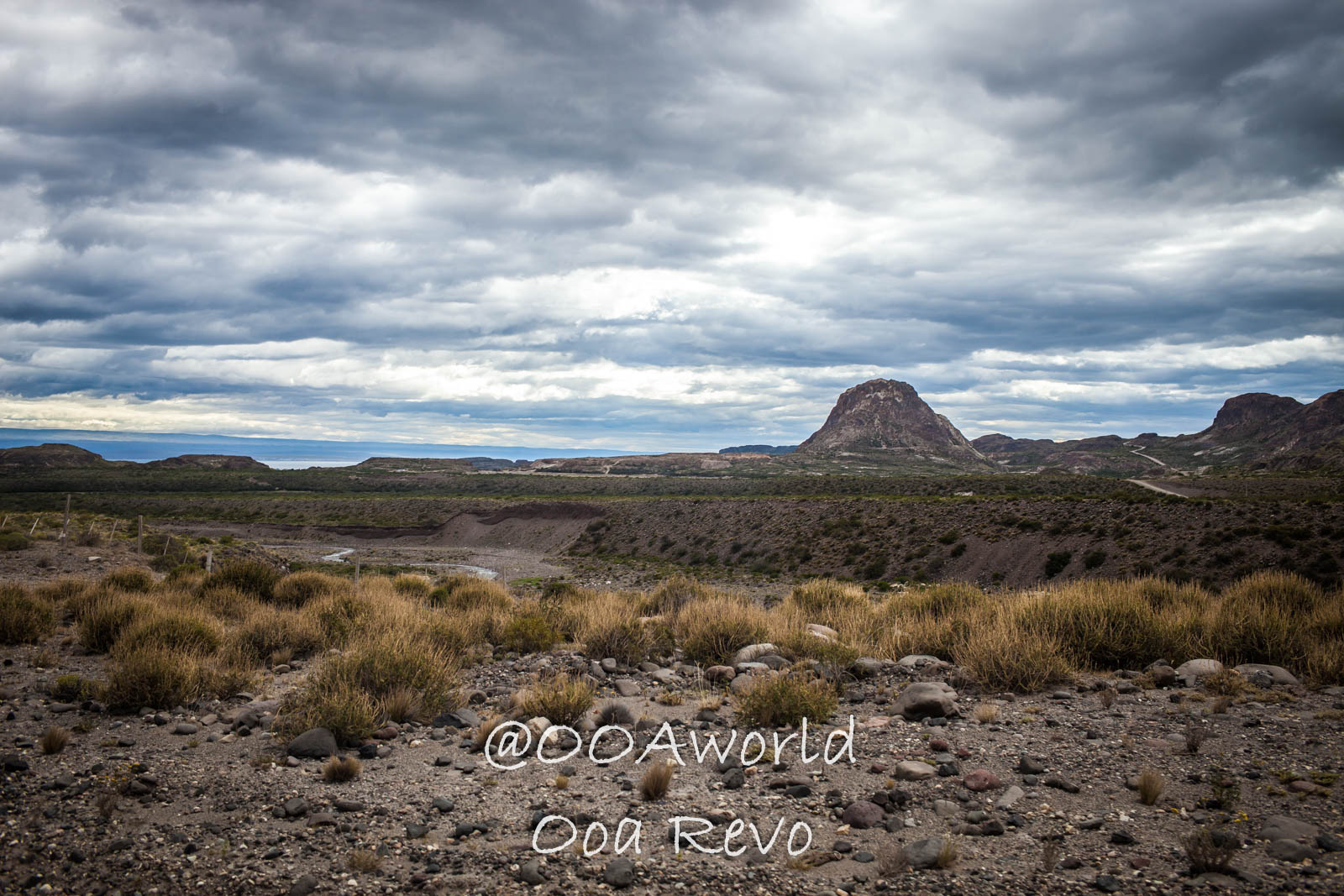 Bus Chile Chico to Puerto Rio Tranquilo Landscapes Chile Chico dramatic landscape with cloudy sky and distant mountain Photo OOAworld