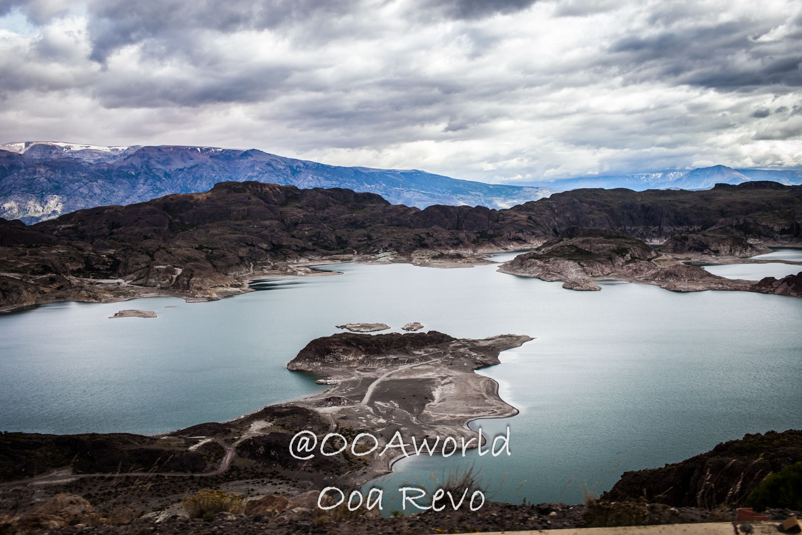 Bus Chile Chico to Puerto Rio Tranquilo Landscapes Chile Chico dramatic lake view with mountainous landscape and overcast sky Photo OOAworld