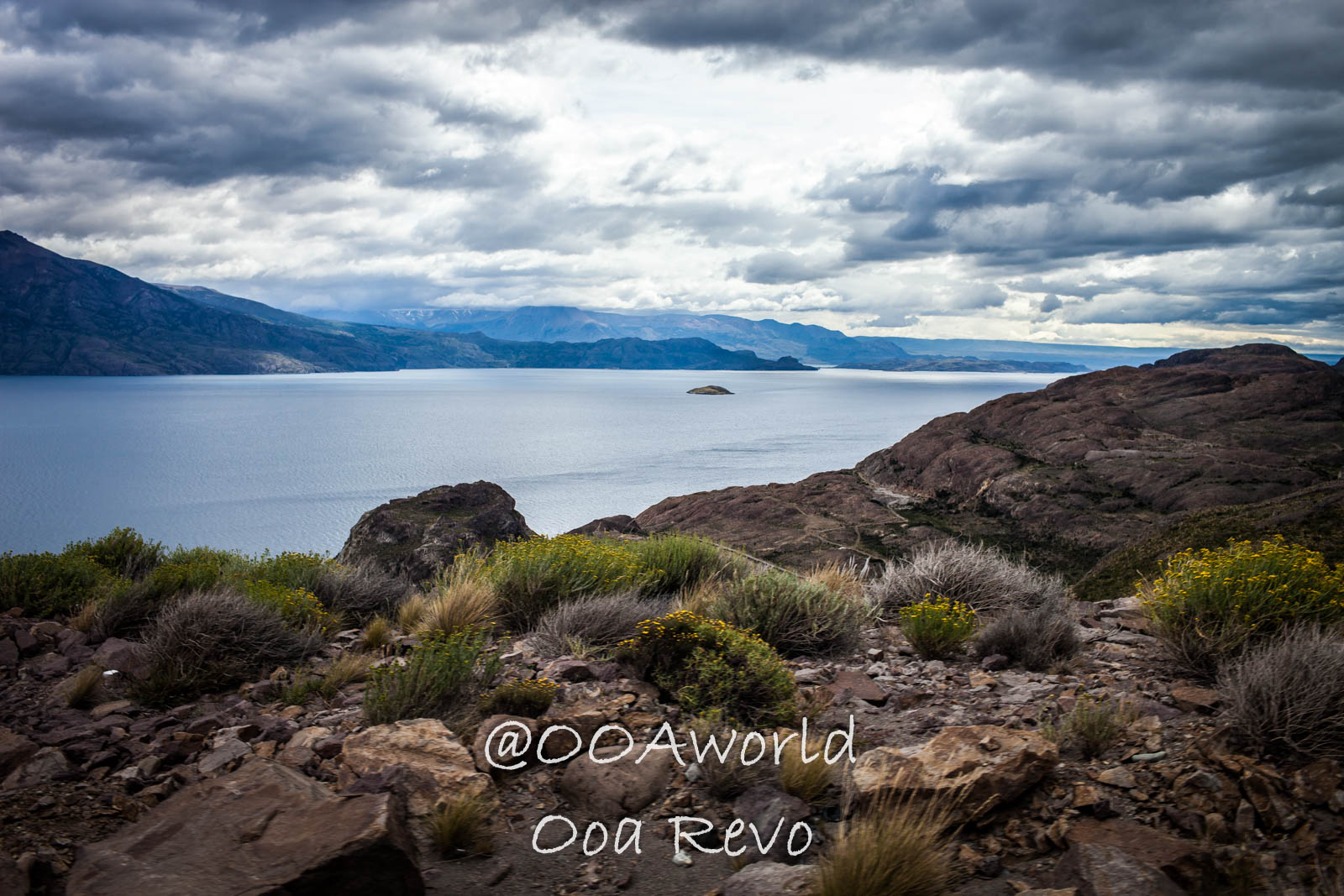 Bus Chile Chico to Puerto Rio Tranquilo Landscapes Chile Chico scenic view of lake mountains and overcast sky Photo OOAworld