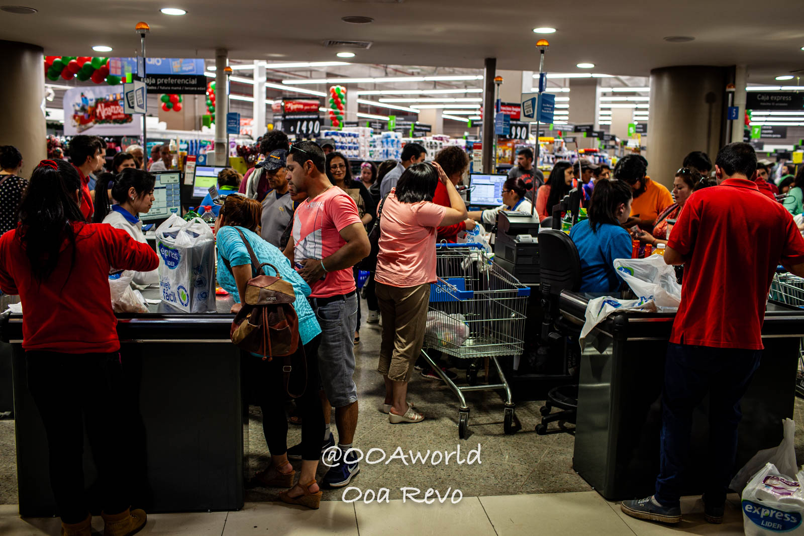 Palafitos and NYE Chiloe busy supermarket checkout line with shoppers Photo OOAworld