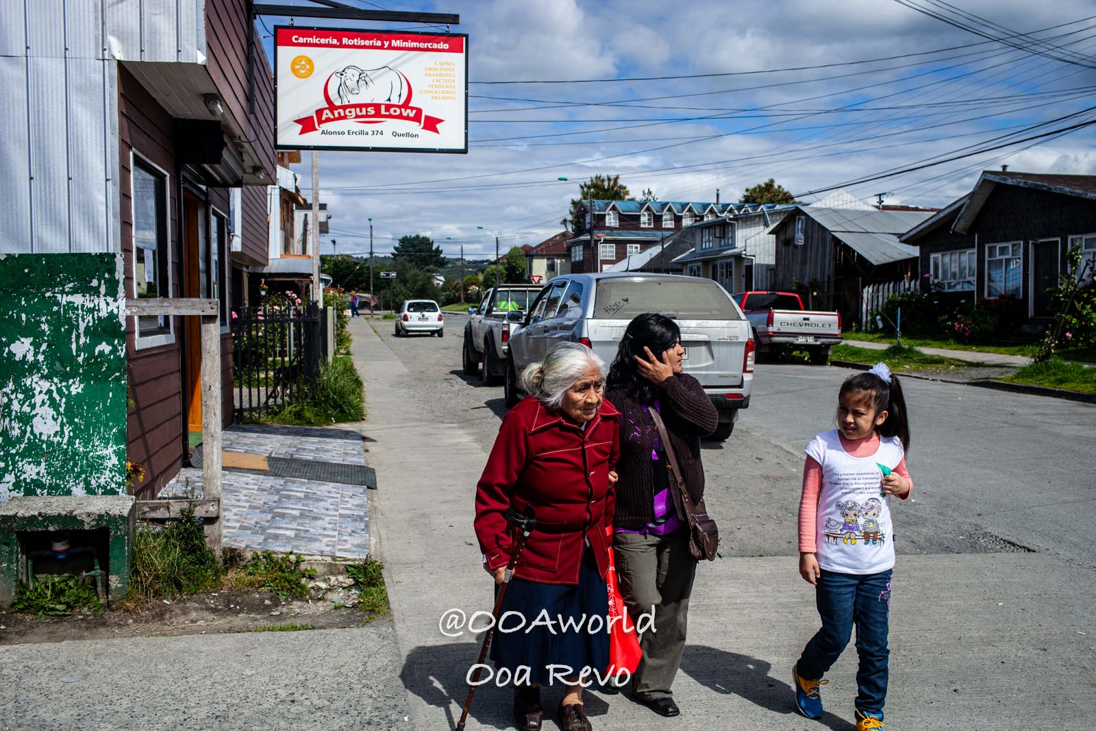 Castro Street Photography Chiloe Street scene in Quellón Chile with local residents Photo OOAworld