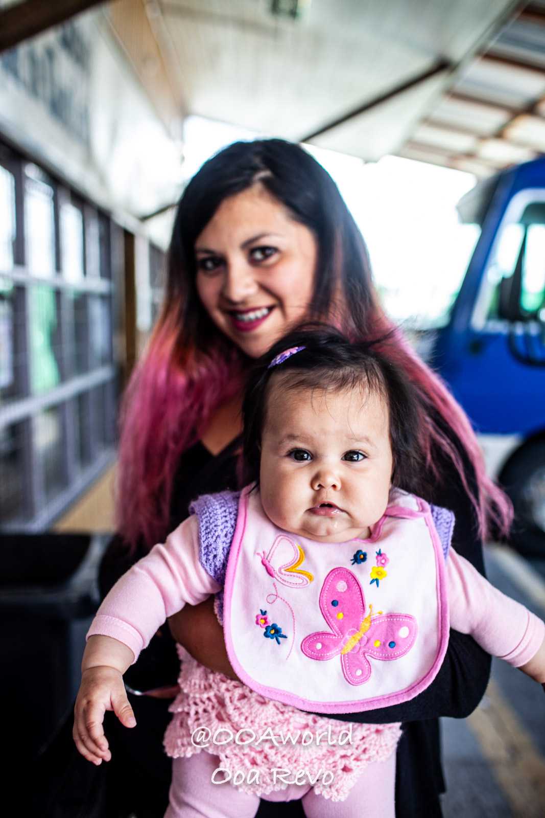 Castro Street Photography Chiloe mother and baby in colorful clothing Photo OOAworld