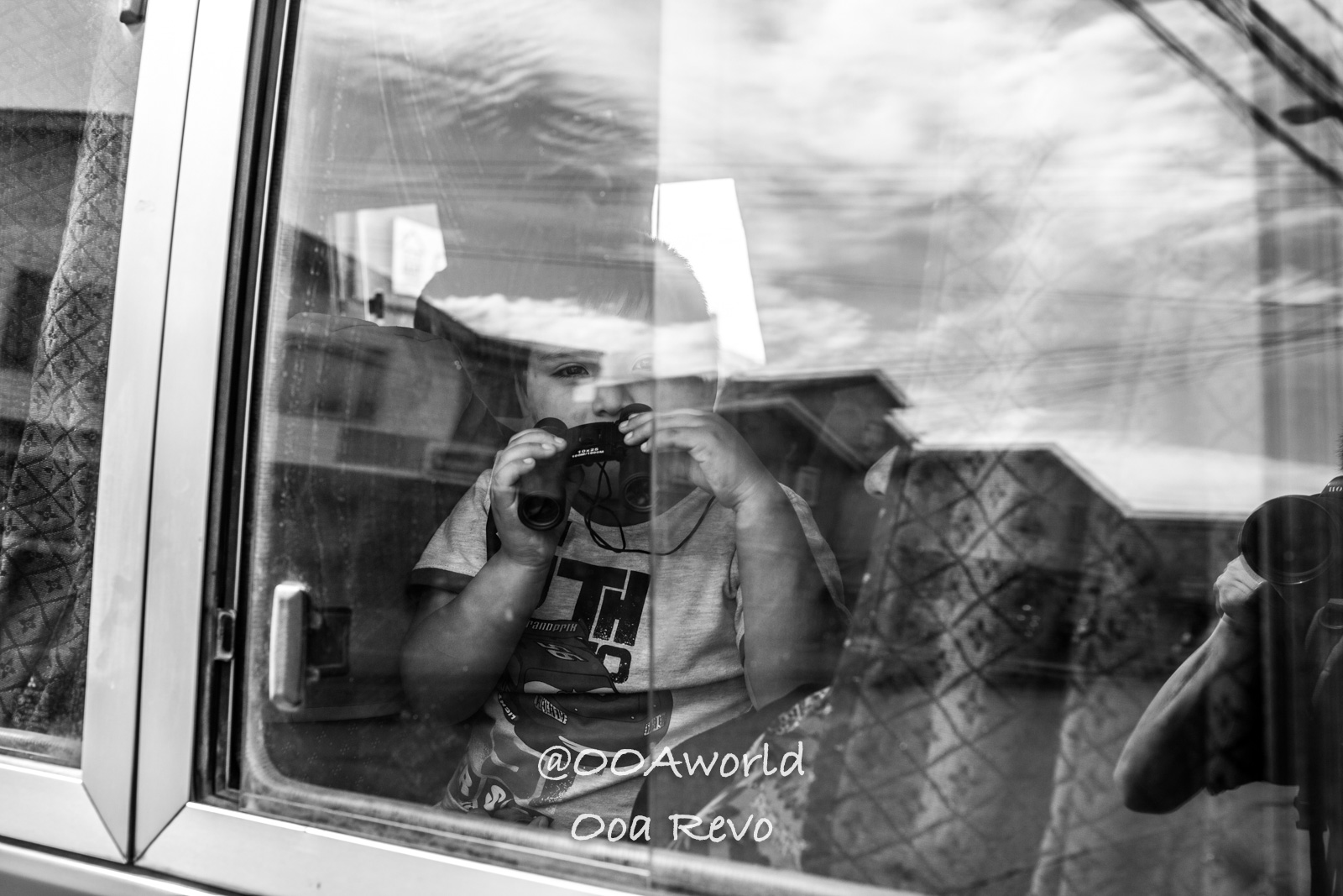 Castro Street Photography Chiloe child with binoculars black and white window reflection Photo OOAworld