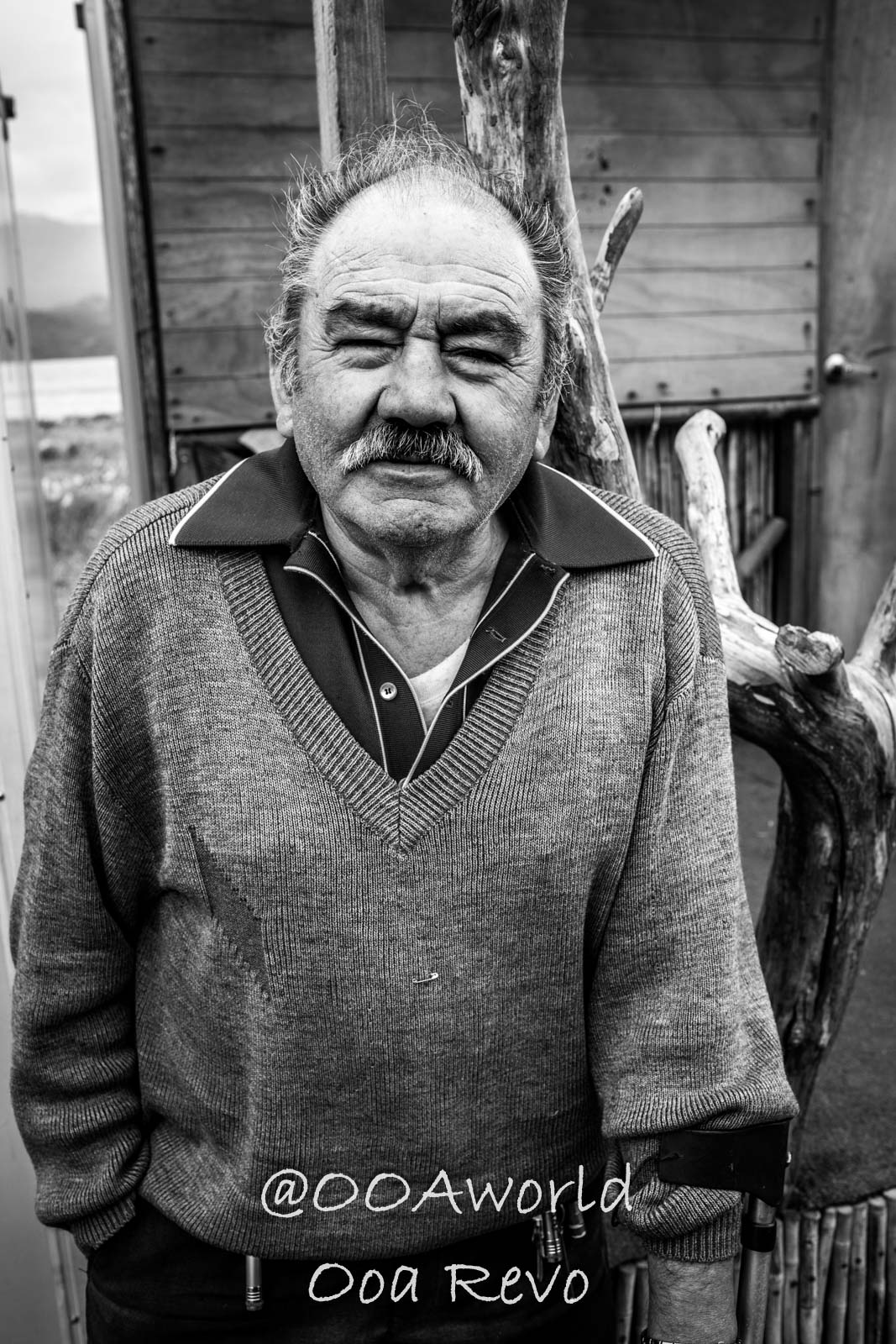 People and Streets Coyhaique portrait of elderly man in sweater black and white Photo OOAworld