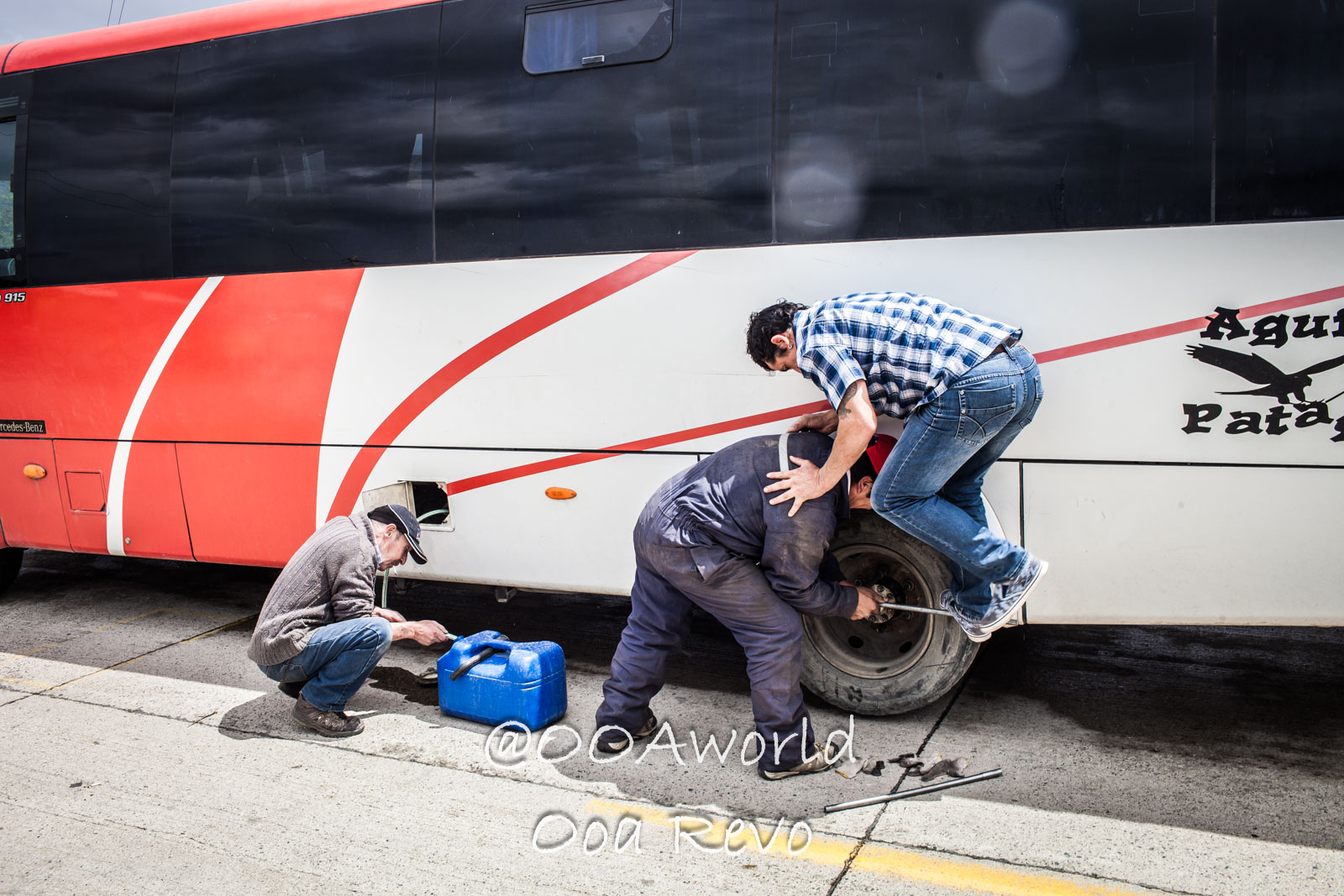 People and Streets Coyhaique bus roadside repair teamwork Photo OOAworld