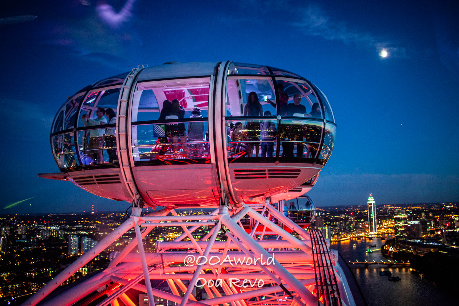 London Eye at night overlooking city skyline Photo OOAworld