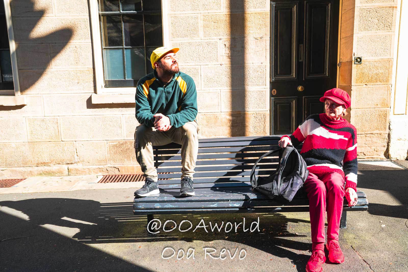 New Sydney Sydney two people sitting on bench in sunlight Photo OOAworld