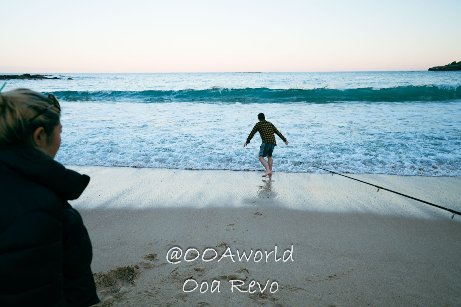 New Sydney Sydney man approaching ocean waves on sandy beach Photo OOAworld