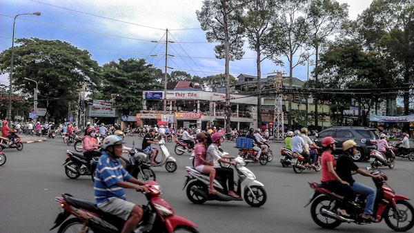 scooters saigon vietnam photo ooaworld Rolling Coconut