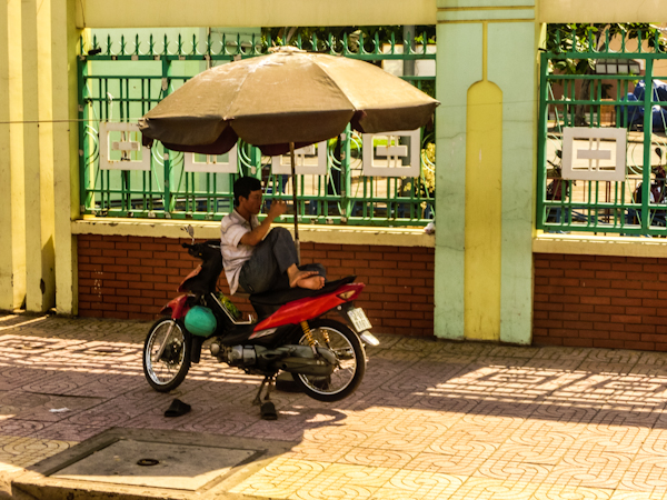 motocyclist rest saigon vietnam photo ooaworld Rolling Coconut