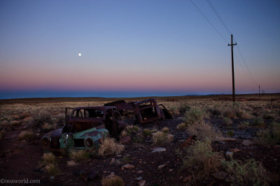 Car wreck near Meteor Crater at sunset, Arizona