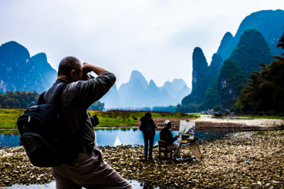 A photographer captures a painter in action, Yangshuo